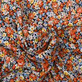 Viscose imprimée fleurs caramel fond marine