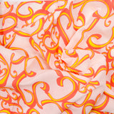 Voile de coton imprimé arabesque orange fond blanc cassé