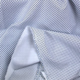 Popeline polycoton imprimée croisillons marine fond blanc