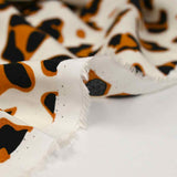 Viscose imprimée savane camel et noir fond écru