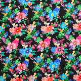 Sergé de coton et viscose champs de fleurs fond noir