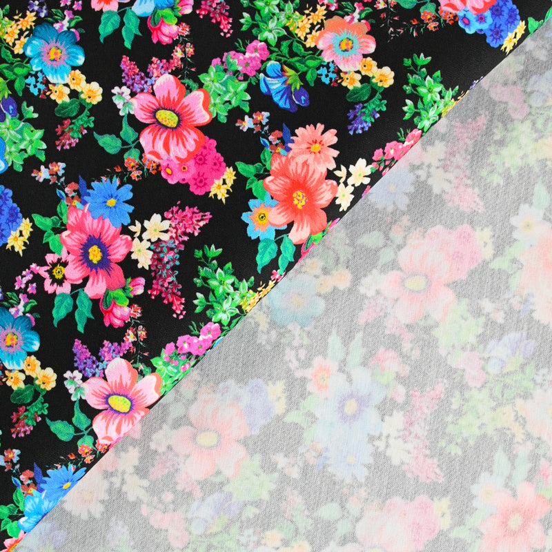 Sergé de coton et viscose champs de fleurs fond noir