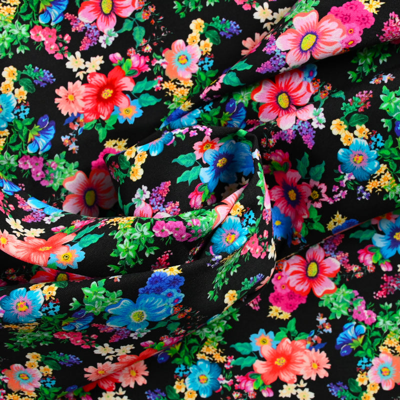 Sergé de coton et viscose champs de fleurs fond noir