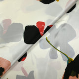Silk satin printed with stylized flowers off-white background