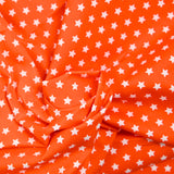 Coton imprimé étoile 1cm orange