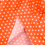 Coton imprimé étoile 1cm orange