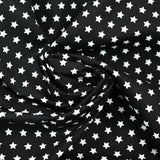 Coton imprimé étoile 1cm noir