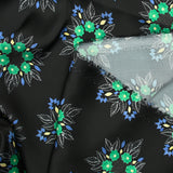 Satin polyester imprimé fleurs vertes fond noir