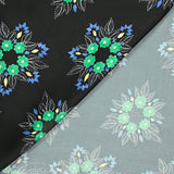 Satin polyester imprimé fleurs vertes fond noir