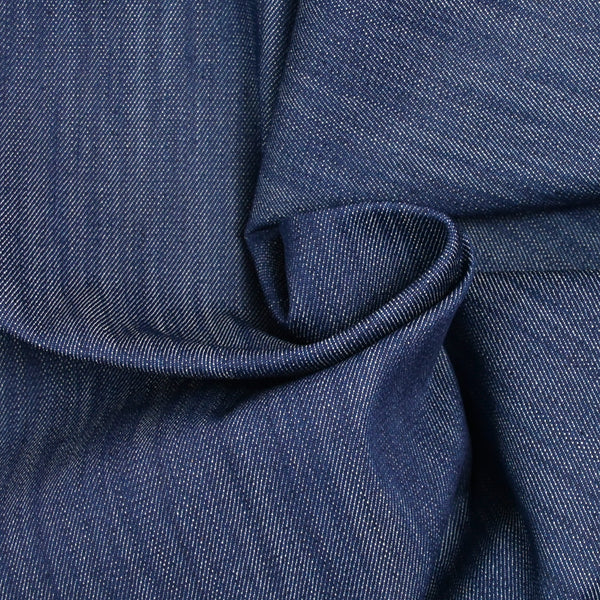 El algodón de Jean por su propia fondo azul