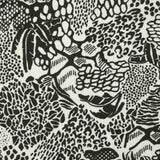 Jersey de coton imprimé jungle dangereuse fond blanc