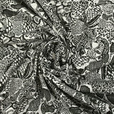 Jersey de coton imprimé jungle dangereuse fond blanc