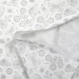 Piqué de coton imprimé papillons et fleurs fond blanc