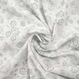 Piqué de coton imprimé papillons et fleurs fond blanc
