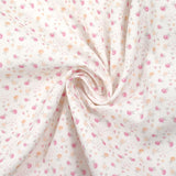 Piqué de coton imprimé fleurs et coeurs rose et orange fond blanc