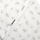 Piqué de coton imprimé hérisson et pois taupe fond blanc