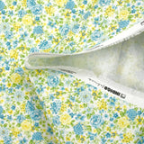 Piqué de coton imprimé les fleurs de Sarah bleu et jaune fond blanc