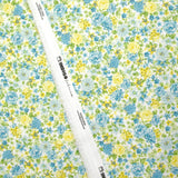 Piqué de coton imprimé les fleurs de Sarah bleu et jaune fond blanc