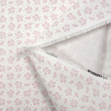 Piqué de coton imprimé brindille dans le vent vieux rose fond blanc