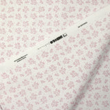 Piqué de coton imprimé brindille dans le vent vieux rose fond blanc