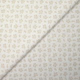 Piqué de coton imprimé brindille dans le vent beige fond blanc