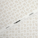 Piqué de coton imprimé brindille dans le vent beige fond blanc