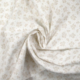 Piqué de coton imprimé brindille dans le vent beige fond blanc