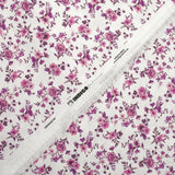 Piqué de coton imprimé les fleurs de Louna violet fond blanc