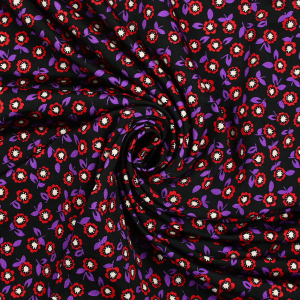 Jersey de viscose imprimé fleurs rouge et violette fond noir