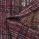 Capucine wool blend tweed, navy and black line, wine background