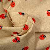 Polycoton imprimé coccinelle fond ficelle