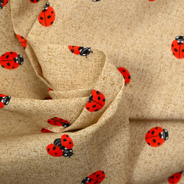 Polycoton imprimé coccinelle fond ficelle