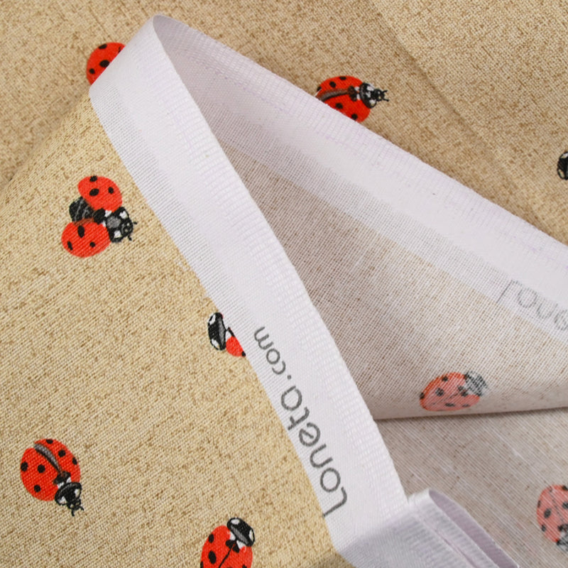Polycoton imprimé coccinelle fond ficelle