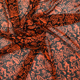 Mousseline imprimée cachemire orange fond noir