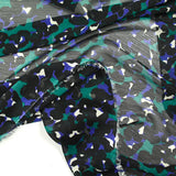 Mousseline crinkle imprimée léopard noir et violet fond vert