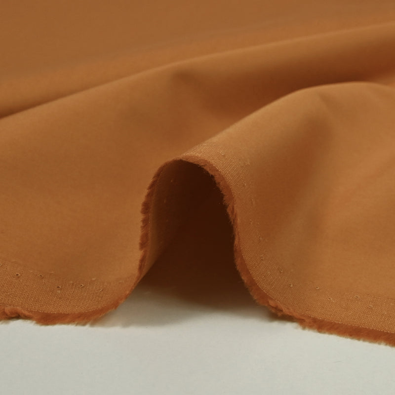 Sergé de coton élasthanne orange brûlé