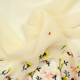 Mousseline de soie brodée festonnée écru au mètre