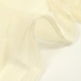 Mousseline de soie brodée festonnée écru au mètre