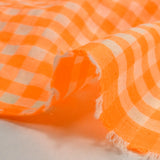 Neon orange and ecru gingham seersucker