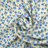 Crêpe viscose imprimé fleurs bleues fond écru