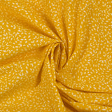 Follaje estampado de algodón con follaje estampado de fondo amarillo