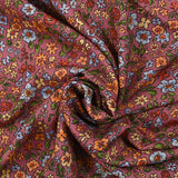 Crêpe viscose imprimé envolée florale fond cassis glacé