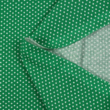 Popeline de coton imprimée mini étoiles fond vert