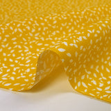 Follaje estampado de algodón con follaje estampado de fondo amarillo