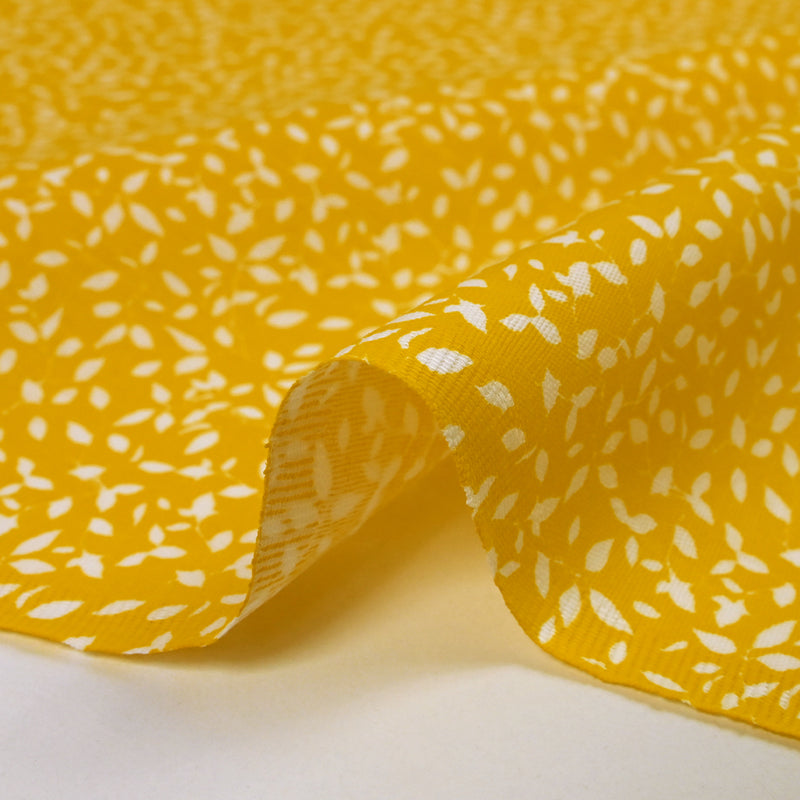 Follaje estampado de algodón con follaje estampado de fondo amarillo