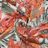 Viscose imprimée fleurs de la jungle corail fond blanc