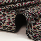 Maille Milano polyviscose graou sauvage framboise fond beige et gris