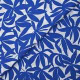 Viscose printed with blue bamboo leaves on white background