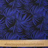 Viscose printed tropical leaves in royal blue with black background