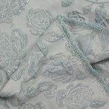 Brocart polyester rosier fond bleu givré